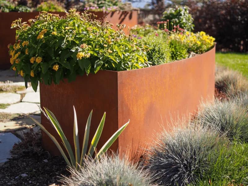 Corten steel planters with drought-tolerant plantings in a converted Weber County yard