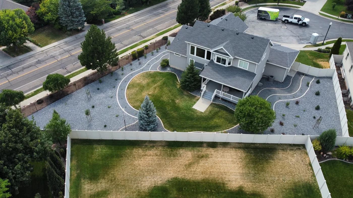 The finished South Ogden conversion seen from the front, with drought-tolerant plantings, gravel, and concrete edging